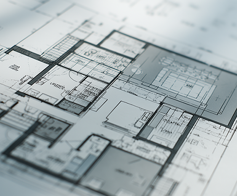Close-up of a 2D architectural floor plan showing room layouts, dimensions, and construction details.